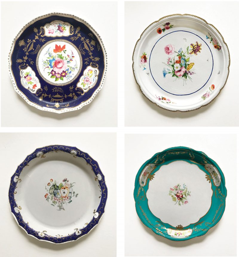 4 paper plates painted with floral designs to look like fine china.