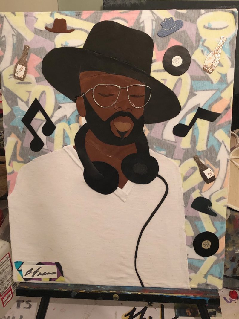 Painting of a DJ wearing a wide brimmed hat, glasses, and headphones around his neck with music notes painted in the background.