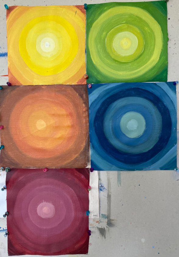 Five paintings together of colored circles within circles within circles