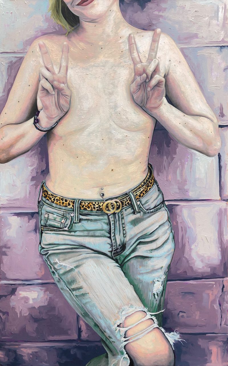Painting of a woman leaning against a brick wall wearing ripped jeans and no tee shirt, making two peace signs with her hands to cover her breasts.