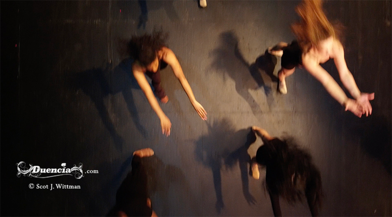 Four figures moving towards the bottom of the shot, actively, taken from above.