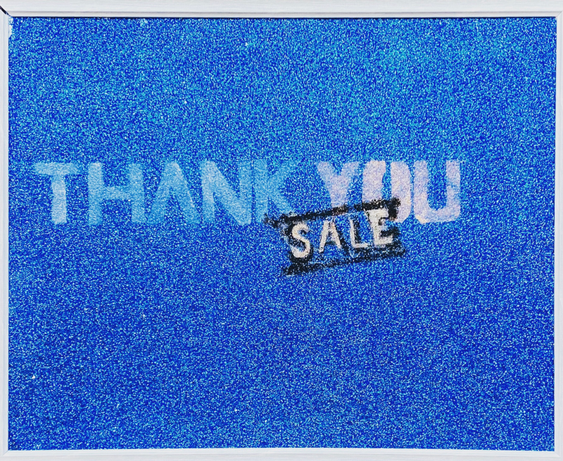 Glittery blue background with the words "THANK YOU / SALE" printed on in stencil print.