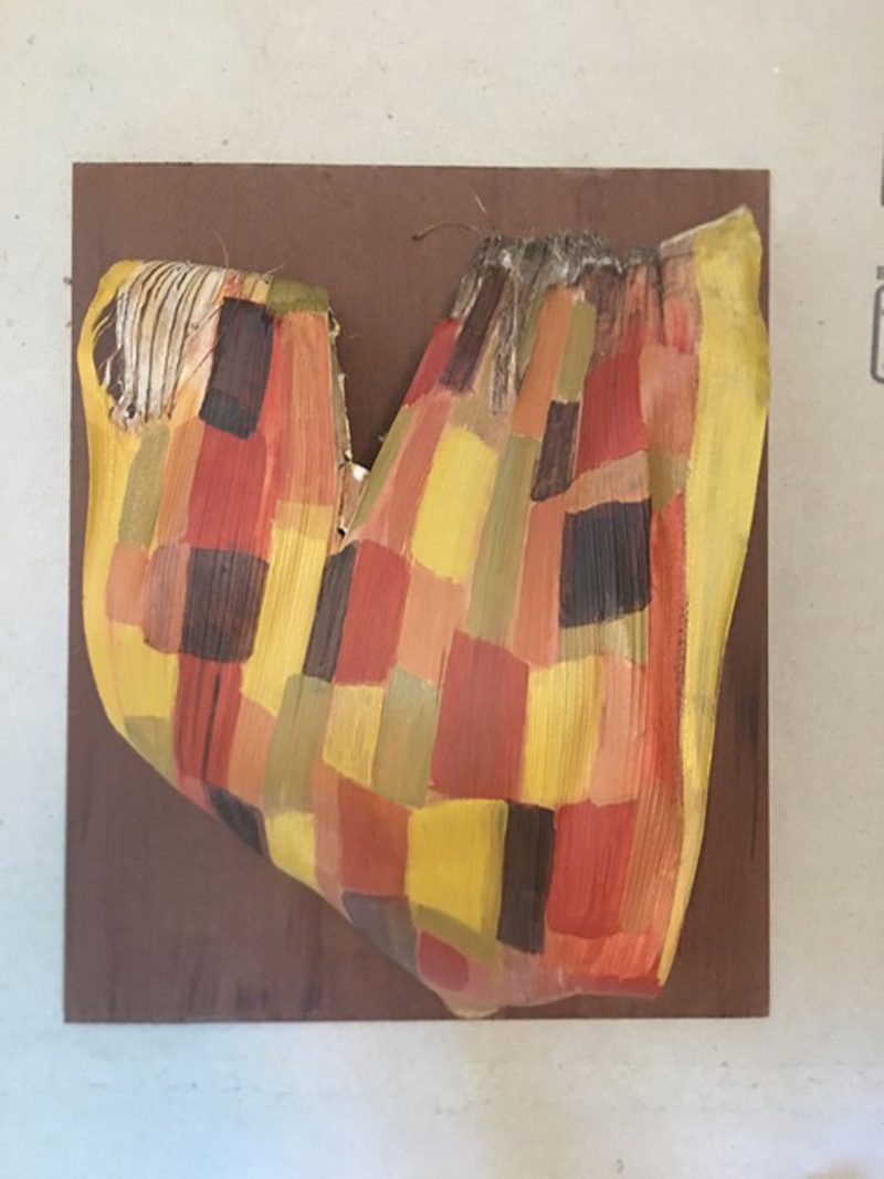 Abstract painting of a misshapen heart-like shape filled with squares. 
