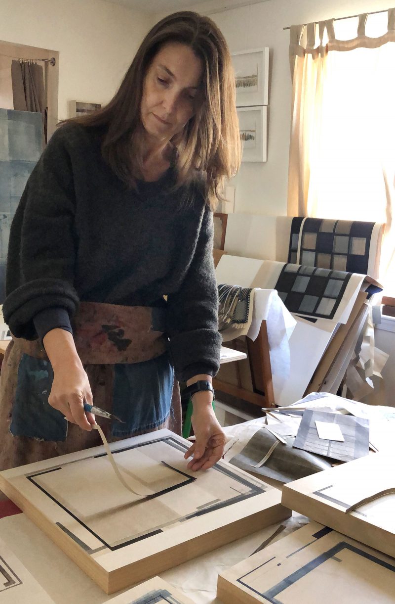 Agathe Bouton painting in her studio.