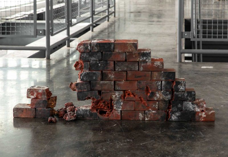 Casts of bricks in a triangular formation with a chunk "burned" out.
