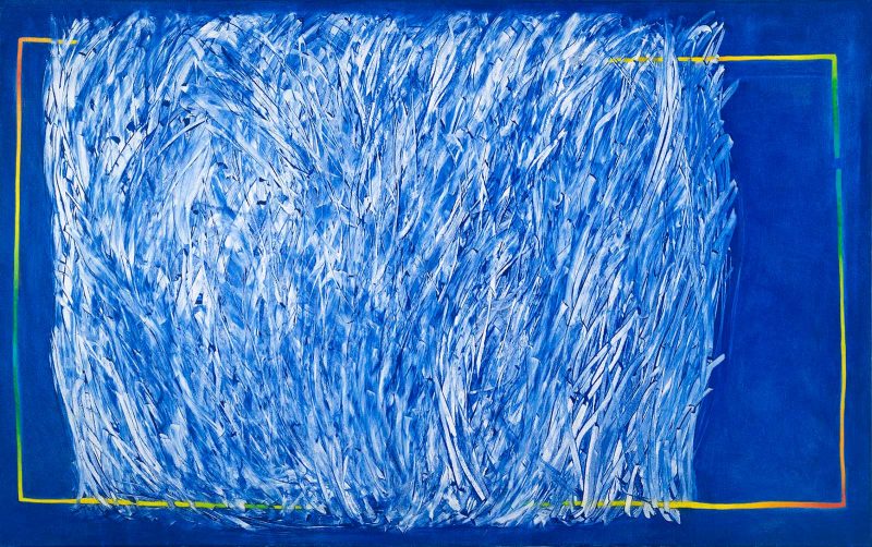 Abstract painting of a blue background with a rectangular mass of white mark making surrounded by a colorful rectangular border