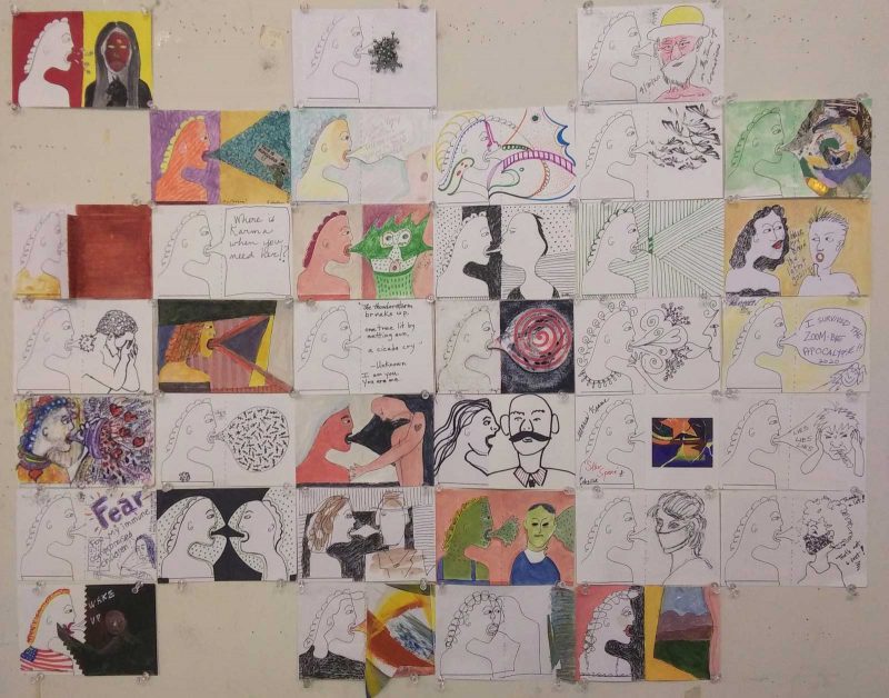 A wall full of drawings, hung up in a row