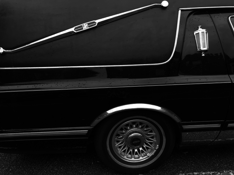 Close-up of the side of a black limousine 
