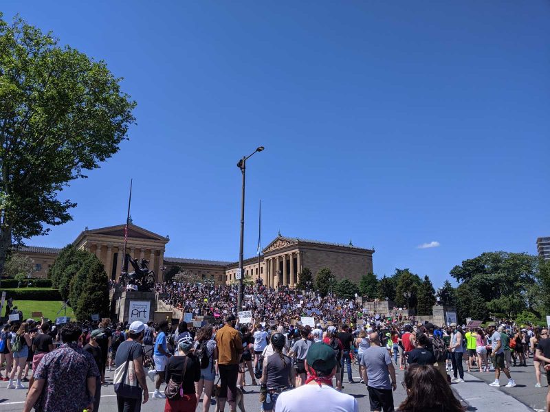 Hundreds of protestors on steps outside of the Philadelphia Museum of Art