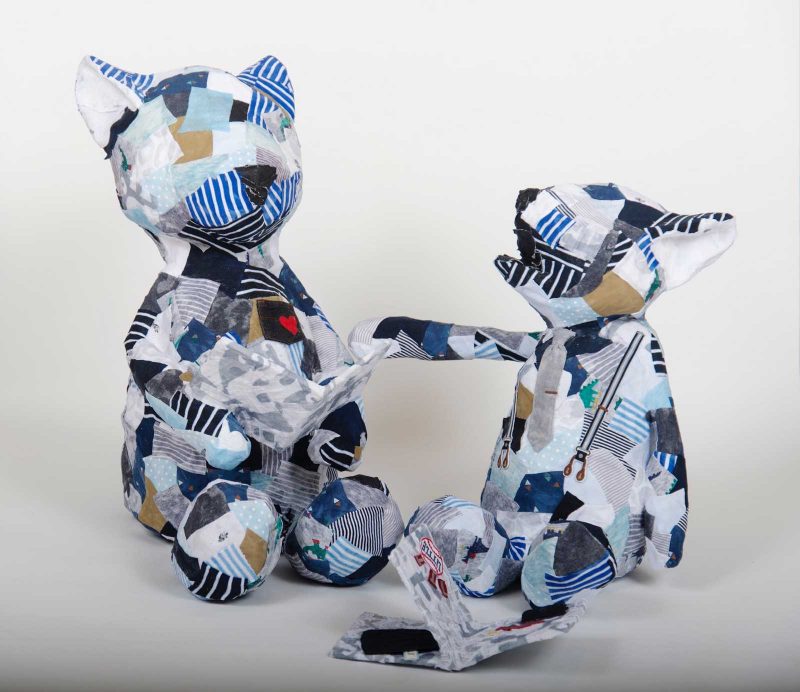 A bear and a fox sculpted out of many different patterned scraps.