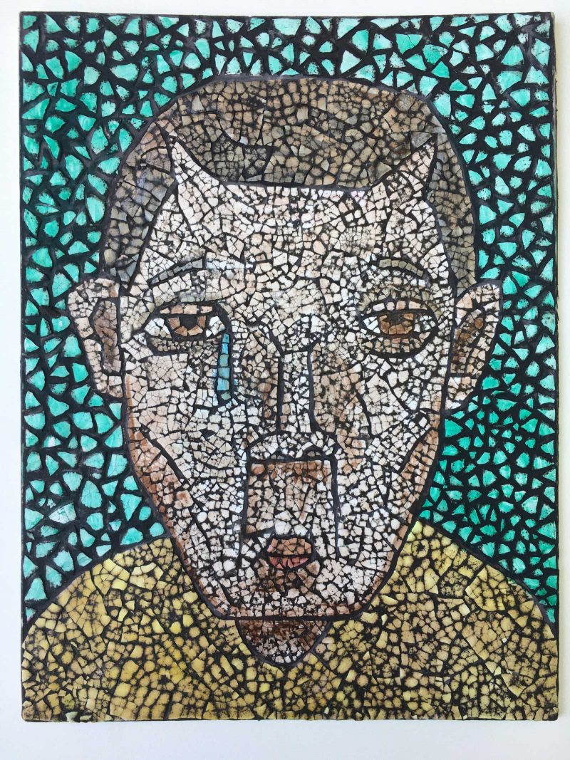 Mosaic style portrait of a masculine young human with angular features and a shaved head.