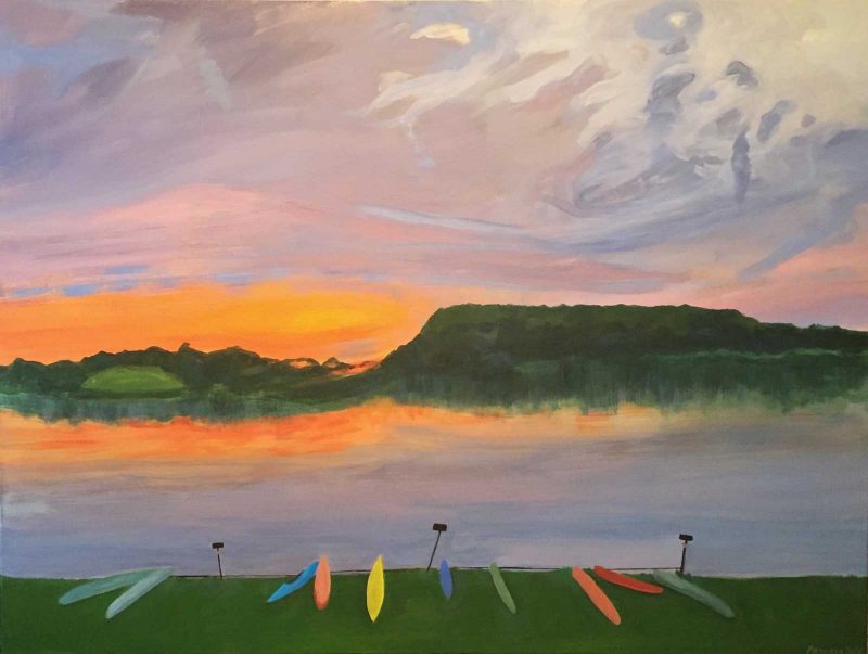 Painting of a lake at sunset with boats laid out on the grass in front of the water