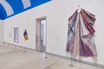 Installation view of the "Expanded Painting" exhibition at the Pennsylvania Museum of Art, featuring a large folded painting surface hanging on the wall by Sam Gilliam.