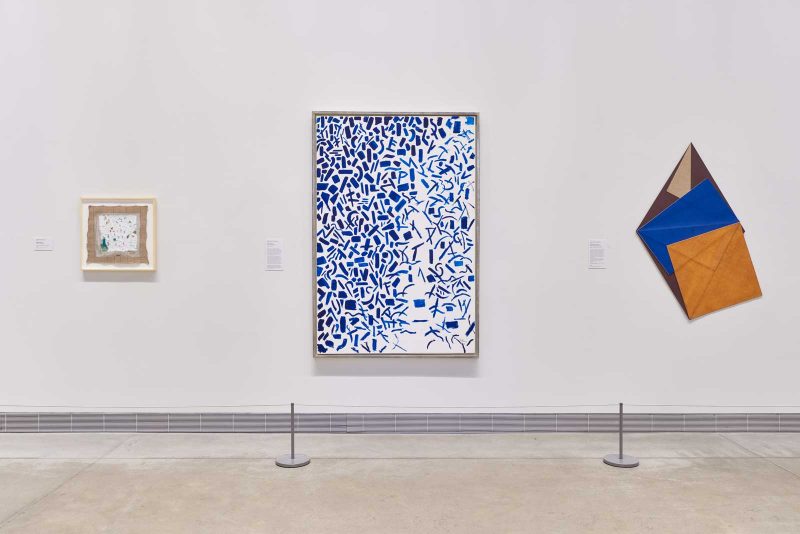 Installation view of the "Expanded painting" exhibition at the Philadelphia Museum of Art, featuring three paintings, central being a large white and blue painting by Alma Thomas.