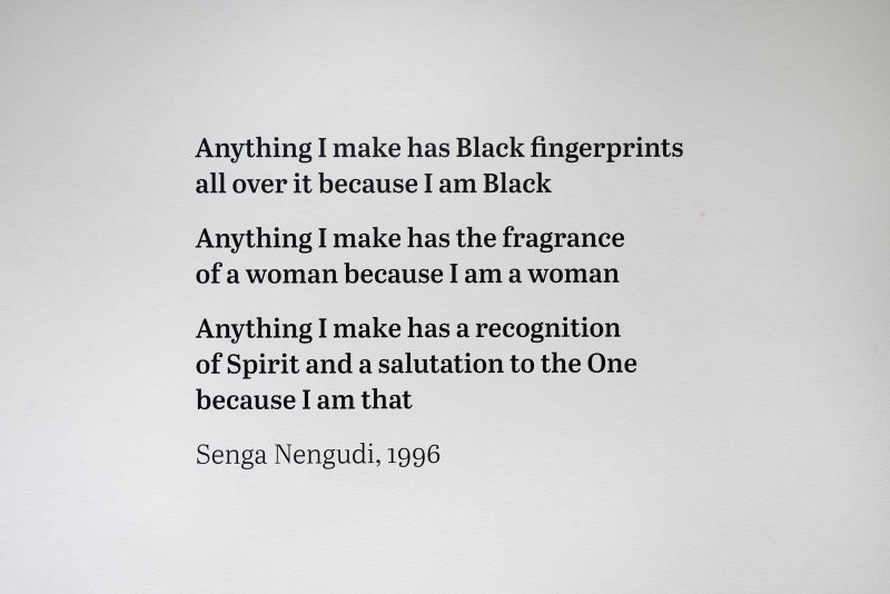 Wall text: "Anything I make has Black fingerprints / all over it because I am Black / Anything I make has the fragrance of a woman because I am a woman / Anything I make has a recognition / of Spirit and a salutation to the One / because I am that / Senga Nengudi, 1996" 