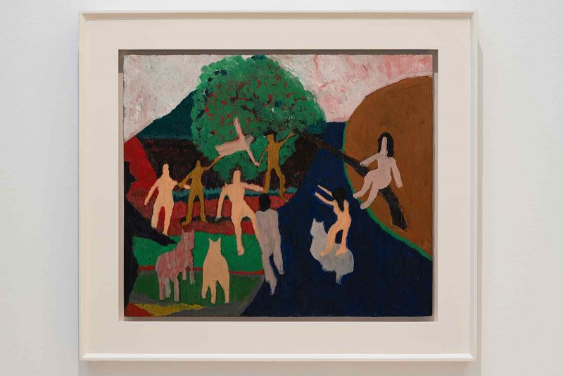 Abstract painting of white and brown featureless humans, and pink and tan flat dogs, dancing and mingling in a bold colored landscape.