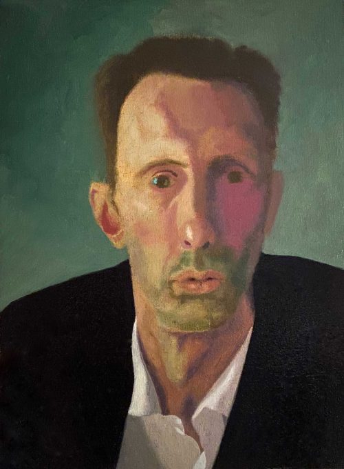Self portrait of Gene Wisniewski, a white man with short brown hair, wearing a black suit jacket and a white shirt.