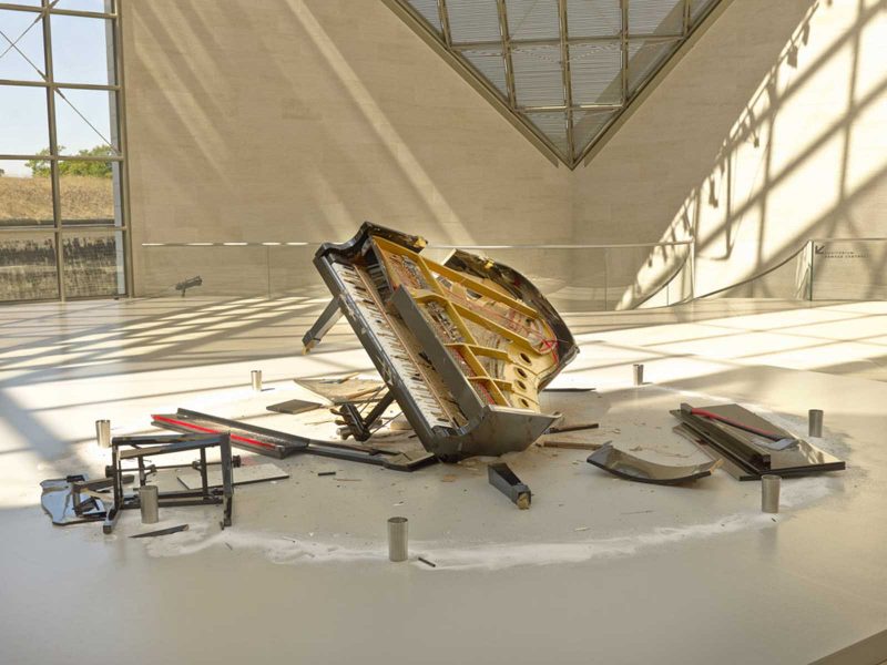 A piano destroyed by Raphael Montañez Ortiz on display in a museum