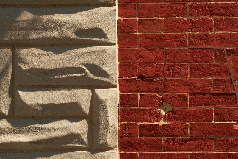 Close up, side-by-side comparison of Formstone (left) and red brick (right).