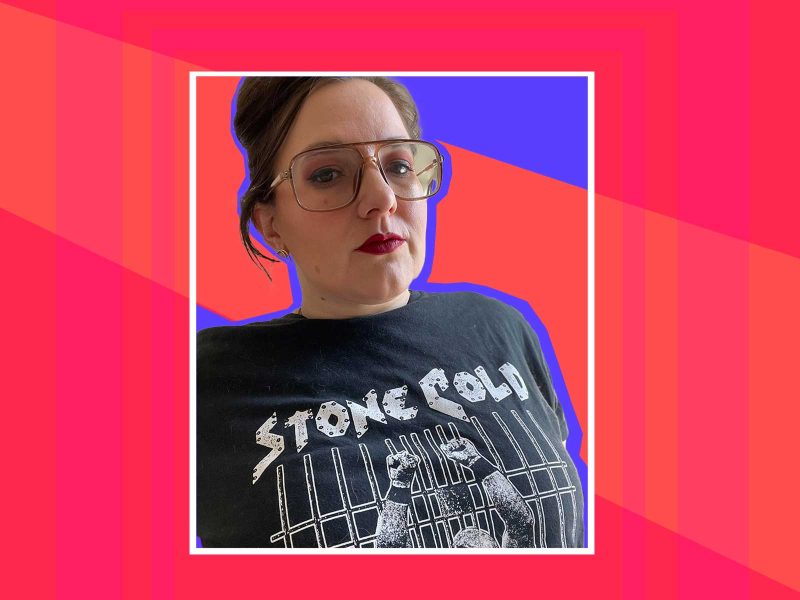 Dr. Melinda Lewis, a white woman with brown, tied back hair, wearing large brown plastic aviator eye glasses, pink eye shadow, red lipstick, and a black shirt that says "stone cold," on a digital decorative background. 