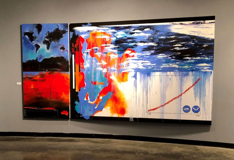 Large abstract diptych painting of melting glaciers and other nature imagery layered with map imagery, e.g. abstracted red climate warming heat maps.