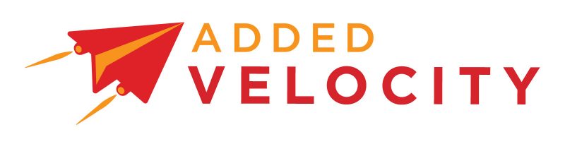 A logo of a red paper plane, flying towards text that reads: "ADDED" (in yellow) and "VELOCITY" (below, in red).