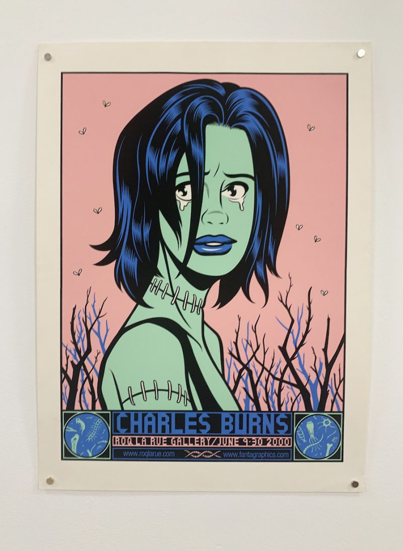The image shows a poster of a stylish woman, crying, her face green, her lips blue, with stitching around her neck and upper arm. The bottom text announces “Charles Burns, with a gallery name and the date, Sept. 30, 2000.