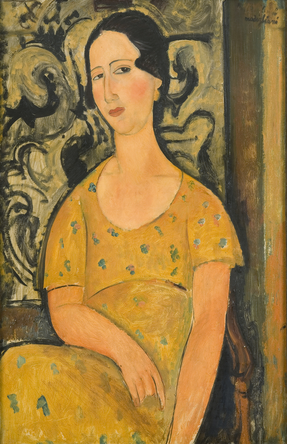 In a painting by Amedeo Modigliani, a woman wearing a patterned yellow dress makes eye contact with the viewer.