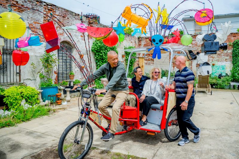 Penny Balkin Bach, former director of the Association for Public Art, rides a fabrication by artist Kai Guo-kiang.