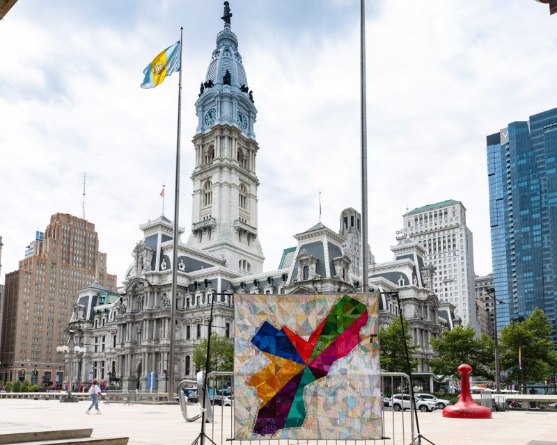Quilt from last year's The People's Budget project in front of City Hall.