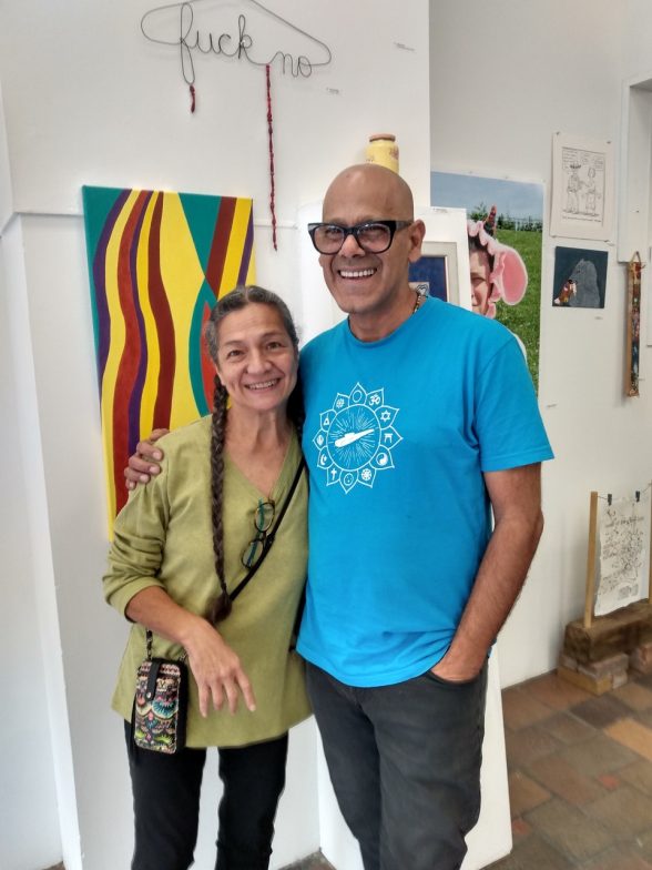 Rocio Cabello and Renny Molenaar, founders of iMPeRFeCT Gallery, standing in front of art.