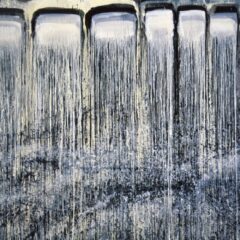a large horizontal canvas composed of black and blue rectangles dripping in a waterfall fashion from top to bottom.