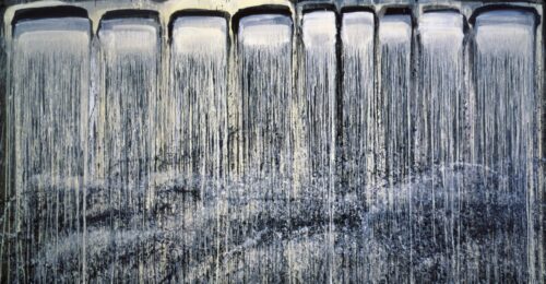 a large horizontal canvas composed of black and blue rectangles dripping in a waterfall fashion from top to bottom.