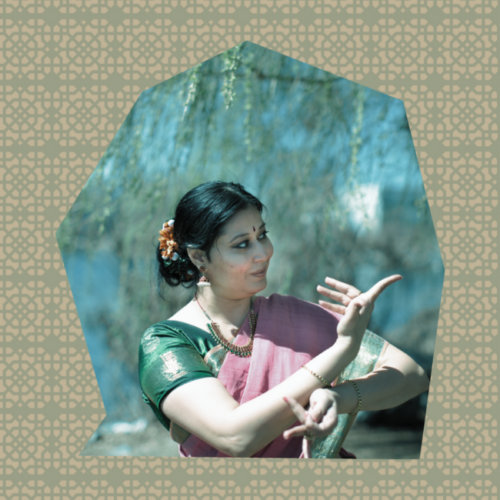 A fair skinned woman presents a contorted hand gesture towards herself and the other towards her right. She wears a sari with green and red with her hair in a bun. She is in the border of an irregiular polygon. the background outside the polygon is a Mashrabiya pattern.