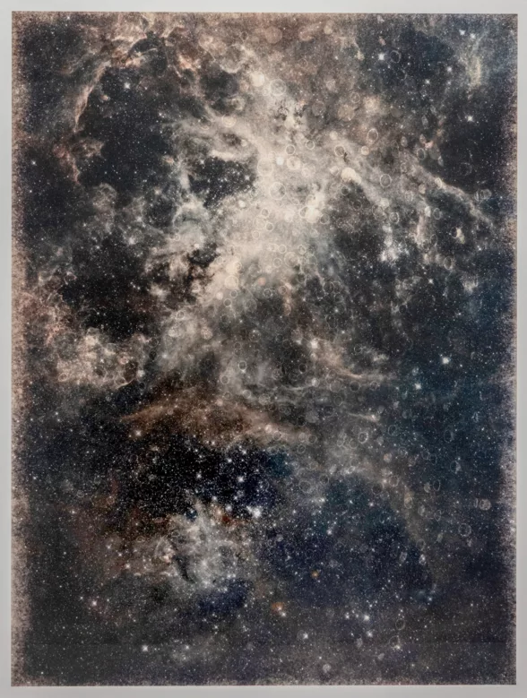An image of Thomas Brummett's work Infinity #8 (For Whistler). The picture displays a black, white, grey, and brown mix of colors creating a galaxy.