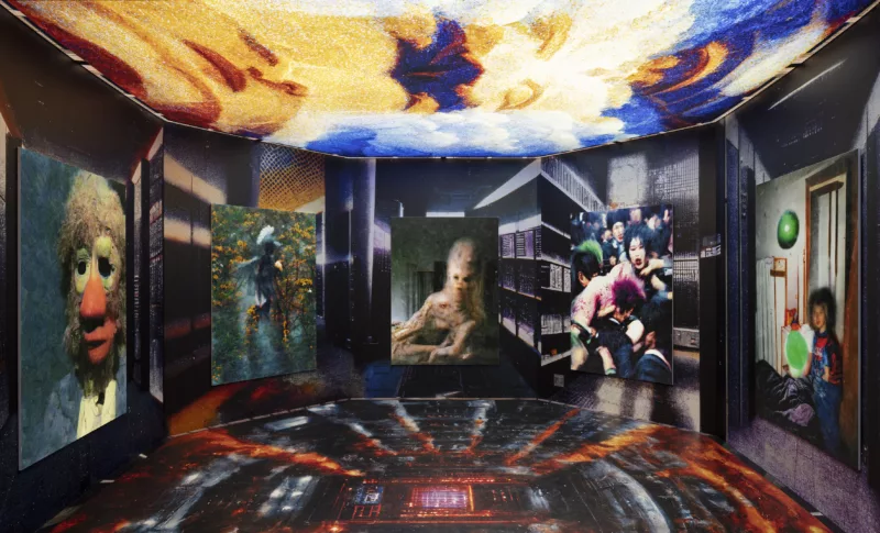 An AI generated image of a room, the walls round and meet one another creating half an octagon. The walls depict vague cityscapes with four canvases on the walls. From the left an image of a person who looks vaguely muppet like. Next an angel or a devil sitting on the branch of an orange flowering tree. The next an uncanny and somewhat disturbing image of a royal lady somewhat resembling a portrait of Marie Antoinette. And last of the wall hangings a crowd of punks, looking as if they are assaulting each other or the woman in the center. The floor of the picture creates an illusion of descending to the depths of hell with streaks of red, black, and grey leading to a central fire tinged rectangle. The ceiling is adorned with a blue, yellow, and white fresco.