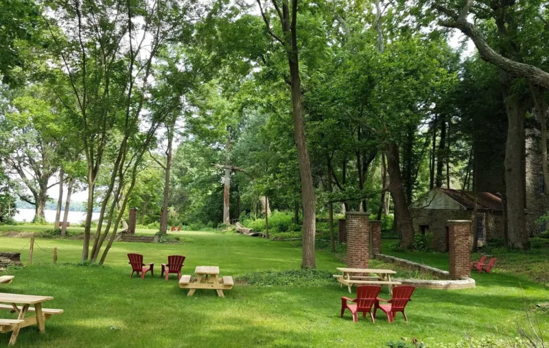 Glen Foerd grounds complete with picnic tables, a historic carriage house, tennis lawn, and river view.