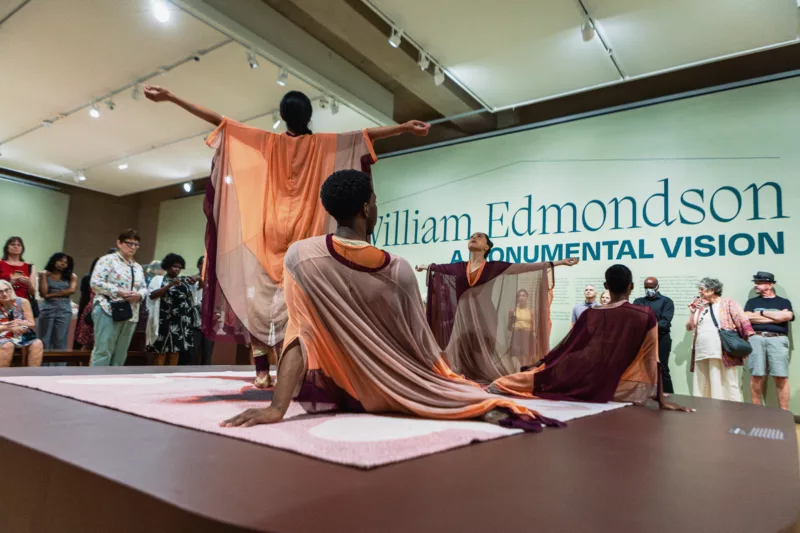 Image of a dance performance titled Returning to Before by Brendan Fernandes. The performance is meant to embody the approach Edmondson had for sculpture and it's place in a museum.
