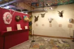 View of Philadelphia's Magic Garden's walls lined with animal heads of different patterns, expression, character and meanings.