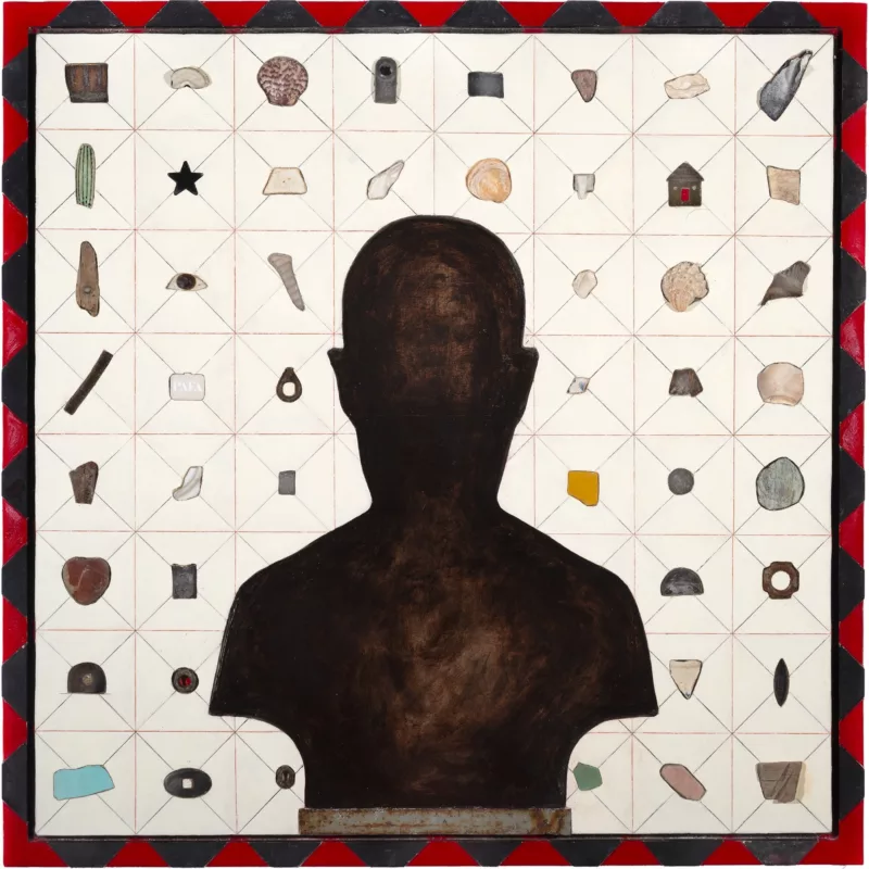 An iconic work shows a deep brown silhouette of a head and shoulders, like a sculpted bust, in front of a grid of boxes in 8 rows and 8 columns, the box filled with small objects, some human-made and some natural objects like stones, wood chips, chips of glass. The frame surrounding the whole is a black and red triangular pattern. The image suggests a metaphysical game board and a player who has control over all