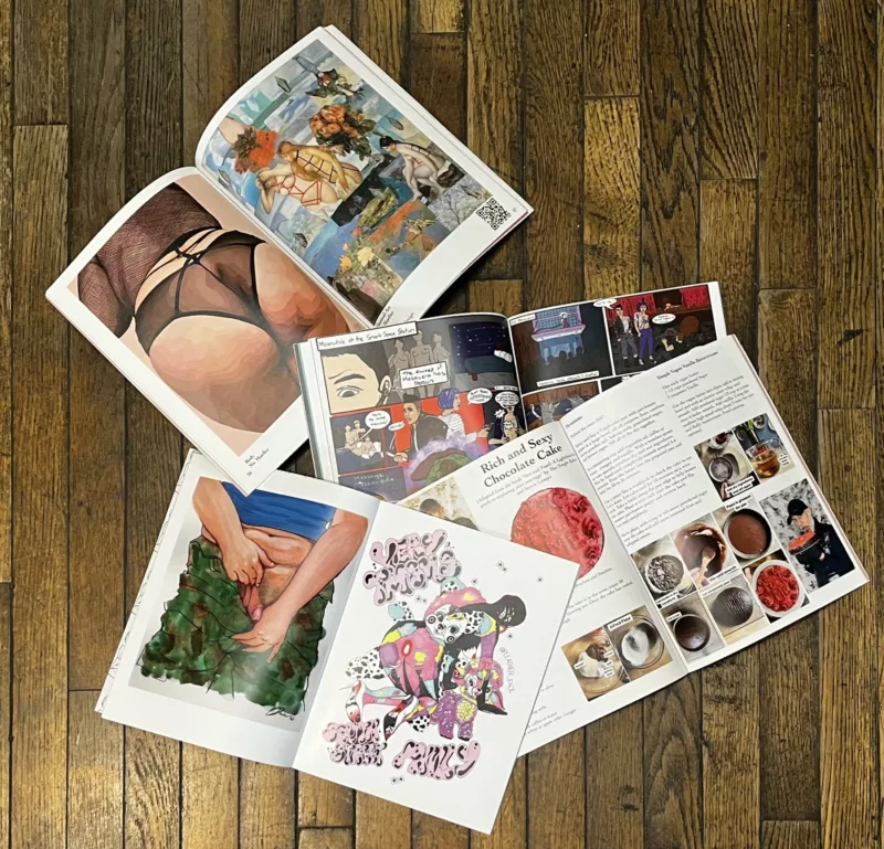 Four ‘Very’ Magazines open to colorful and artsy page spreads, on a dark wood floor. 