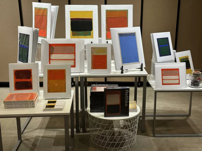 A large number of colorful prints by Mark Rothko stand on a several tables in a giftshop at the National Gallery of Art