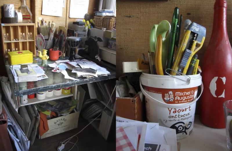 Two images spliced together show views of artist Matthew Rose’s studio, which is filled with papers, paints, brushes, scissors, cutting tools, tape, glue, and piles of papers, with occasional tchotchke’s in the space as well.