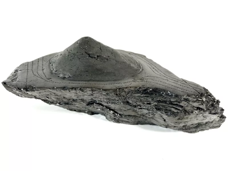A model of a coal stockpile, made from carved anthracite coal shows rail lines surrounding a mound of coal, representing coal mining processes in earlier days.