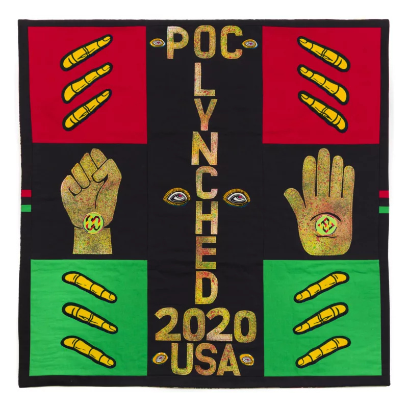 A quilt image with a deep black background and red, green and gold features words and images indicating a political message against lynching of people of color. 