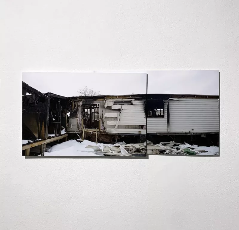 Two photographs have been collaged together showing a mobile home that has suffered catastrophic damage from what might be a fire.