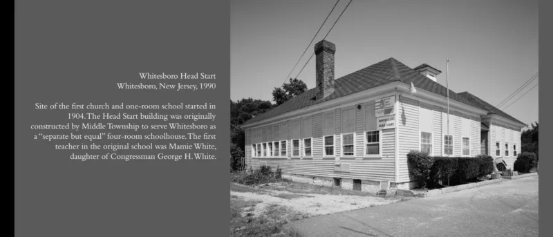 A black and white photo of a well-kept, one-story building with a sign on it announcing “Whitesboro Head Start.” The building is fronted by some ornamental shrubs and a flag pole (no flag).