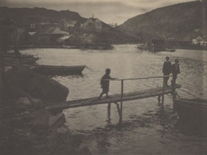 "Untitled (Three Children on Log Pier, Newfoundland),” 1912, platinum, 7 x 9.5 in.