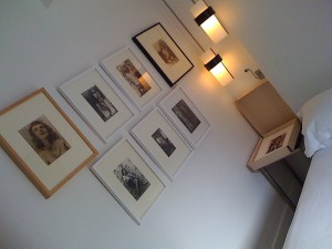 A wall of semi-nude duo-tone photographs by American Eugene Von Bruenchenhein (1910–1983), at the Fleisher/Ollman Gallery suite.