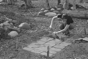 UCSD graduate student Virginia Maksymowicz installing her anonymous sculpture "Thirty Blocks" in 1976. Photo by Blaise Tobia.